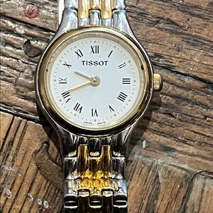 Tissot Gold and Silver Roman Numeral Watch women’s